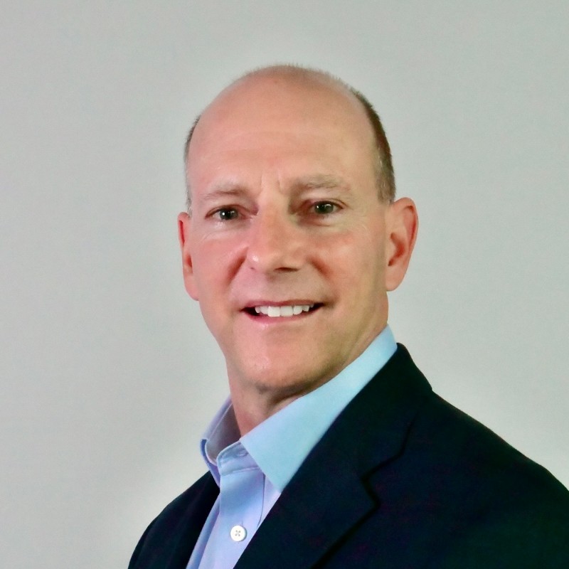 Headshot of a smiling man