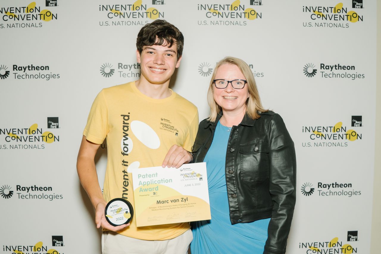 Marc Van Zyl of Team Athegia with Lucie Howell, Chief Learning Officer of The Henry Ford Museum of American Innovation at the 2022 Raytheon Technologies Invention Convention U.S. Nationals held at the museum in spring.